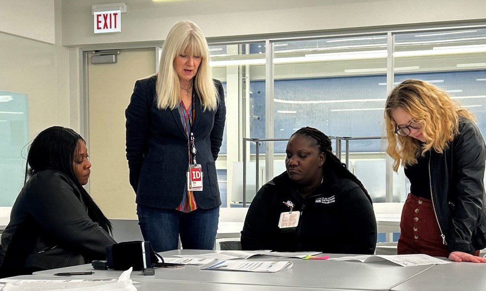 Kim Erwin discussing project with Community Health Workers and Nurse Kim Erwin discussing project with Community Health Workers and Nurse